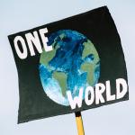 one world placard international global solidarity